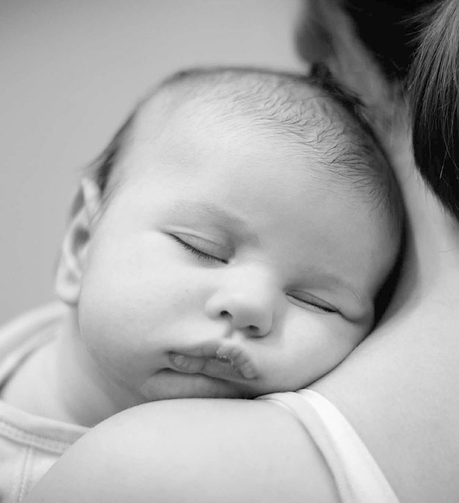 Baby cant. Black and White Baby hugging.